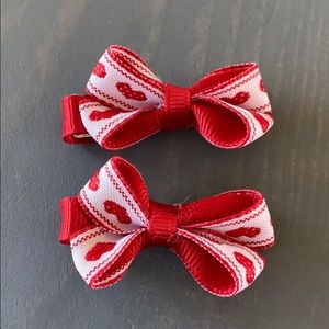 Little 2 piece heart bow clips. Brand new.
